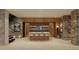 Impressive wine cellar with custom built-in shelving and tasting bar at 7499 Preservation Trl, Parker, CO 80134