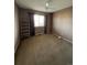 Bedroom with ceiling fan, window, and built-in shelving at 21620 E Crestline Ln, Centennial, CO 80015