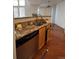 Kitchen with granite countertops, stainless steel appliances, and wood cabinets at 21620 E Crestline Ln, Centennial, CO 80015