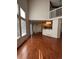 Open living room and kitchen area with hardwood floors at 21620 E Crestline Ln, Centennial, CO 80015