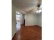 Living room with hardwood floors and a view into another room at 21620 E Crestline Ln, Centennial, CO 80015