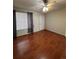 Living room with hardwood floors, window, and ceiling fan at 21620 E Crestline Ln, Centennial, CO 80015