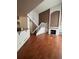Spacious living room with hardwood floors and a staircase at 21620 E Crestline Ln, Centennial, CO 80015
