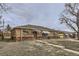 Brick ranch home with a carport and landscaping at 9030 Hickory Pl, Thornton, CO 80229