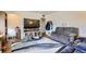 Living room with gray sofas and a large TV at 9030 Hickory Pl, Thornton, CO 80229