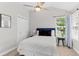 Cozy bedroom with a queen-size bed and natural light at 1817 Peregrine Ln, Broomfield, CO 80020