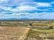 Aerial view of the property, showcasing the surrounding landscape and nearby amenities at 13831 Downing St, Thornton, CO 80602