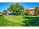 Community putting green with manicured lawn and flags at 3144 S Wheeling Way # 410, Aurora, CO 80014