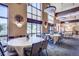 Bright dining room with large windows and tables at 3144 S Wheeling Way # 410, Aurora, CO 80014