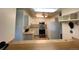 White kitchen cabinets, stainless steel appliances, and a breakfast bar at 3144 S Wheeling Way # 410, Aurora, CO 80014