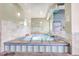 Relaxing hot tub with tiled surround and spa rules posted at 3144 S Wheeling Way # 410, Aurora, CO 80014