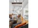 Living room with hardwood floors, high ceilings, and staircase at 3228 S Xanadu St, Aurora, CO 80014
