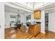 Light and airy dining area with hardwood floors and a chandelier at 3228 S Xanadu St, Aurora, CO 80014