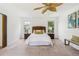 Bright bedroom with ceiling fan and carpet at 3228 S Xanadu St, Aurora, CO 80014