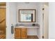 Bathroom with wood vanity and a large mirror at 3228 S Xanadu St, Aurora, CO 80014