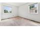 Bright bedroom featuring neutral walls and carpeted floors at 3228 S Xanadu St, Aurora, CO 80014