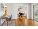 Bright dining area with hardwood floors and glass table for four at 3228 S Xanadu St, Aurora, CO 80014