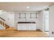 Finished basement with wet bar and laminate flooring at 3228 S Xanadu St, Aurora, CO 80014