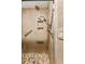 Updated bathroom with walk-in shower, grab bars, and modern fixtures at 3228 S Xanadu St, Aurora, CO 80014
