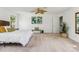 Primary bedroom with ceiling fan, carpet, and large windows at 3228 S Xanadu St, Aurora, CO 80014