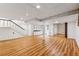Finished basement with laminate flooring and wet bar at 3228 S Xanadu St, Aurora, CO 80014