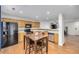 Eat-in kitchen featuring wood cabinets, granite counters, and black appliances at 4689 S Swadley Way, Morrison, CO 80465