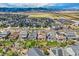Aerial view of community with houses, roads, and landscaping at 9884 Eagle River St, Littleton, CO 80125