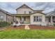 Two-story house with backyard, patio, and landscaping at 9884 Eagle River St, Littleton, CO 80125