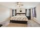 Spacious main bedroom with ceiling fan and ample natural light at 9884 Eagle River St, Littleton, CO 80125