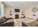 Spacious living room featuring a fireplace and ample natural light at 9884 Eagle River St, Littleton, CO 80125