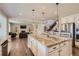 Open concept kitchen with large island and views into Gathering room at 9884 Eagle River St, Littleton, CO 80125