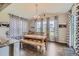 Charming dining room featuring a rustic wooden table and bench at 9884 Eagle River St, Littleton, CO 80125