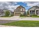 Two-story house with a two-car garage and landscaping, wide view at 9884 Eagle River St, Littleton, CO 80125