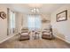 Relaxing living room featuring two armchairs and a coffee table at 9884 Eagle River St, Littleton, CO 80125