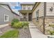 House exterior with stone and siding, walkway and landscaping at 9884 Eagle River St, Littleton, CO 80125