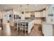 Well-equipped kitchen with white cabinets and granite countertops at 9884 Eagle River St, Littleton, CO 80125