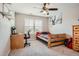Spacious bedroom with a wood bed frame and desk area at 9884 Eagle River St, Littleton, CO 80125