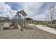 playground with play structures and benches at 9884 Eagle River St, Littleton, CO 80125