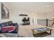Bright bonus room features a comfortable seating area at 9884 Eagle River St, Littleton, CO 80125