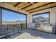 Outdoor kitchen with stainless steel appliances and seating at 9884 Eagle River St, Littleton, CO 80125