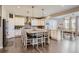 Modern kitchen with large island, granite countertops, and stainless steel appliances at 9884 Eagle River St, Littleton, CO 80125