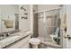 Bathroom with walk-in shower and granite countertop at 9884 Eagle River St, Littleton, CO 80125