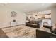 Open living room with a view of the kitchen and hardwood floors at 9884 Eagle River St, Littleton, CO 80125