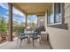 Covered patio with seating area, grill, and view of backyard at 9884 Eagle River St, Littleton, CO 80125