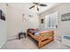 Cozy bedroom with wood framed bed and large window at 9884 Eagle River St, Littleton, CO 80125
