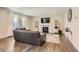 Comfortable Gathering room with hardwood floors and a fireplace at 9884 Eagle River St, Littleton, CO 80125