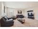 Spacious bonus room with comfortable seating and a TV at 9884 Eagle River St, Littleton, CO 80125