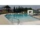 Community pool with lifeguard stand and plenty of lounge chairs at 16656 E 110Th Ave, Commerce City, CO 80022