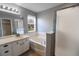 Bathroom with soaking tub, separate shower, and vanity with marble top at 9362 Autumn Ash Ct, Highlands Ranch, CO 80126