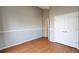 Bright bedroom with hardwood floors and double door closet at 9362 Autumn Ash Ct, Highlands Ranch, CO 80126
